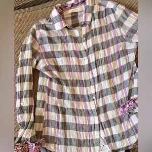 Anthropologie lightweight button down shirt with lace detailing in the back.